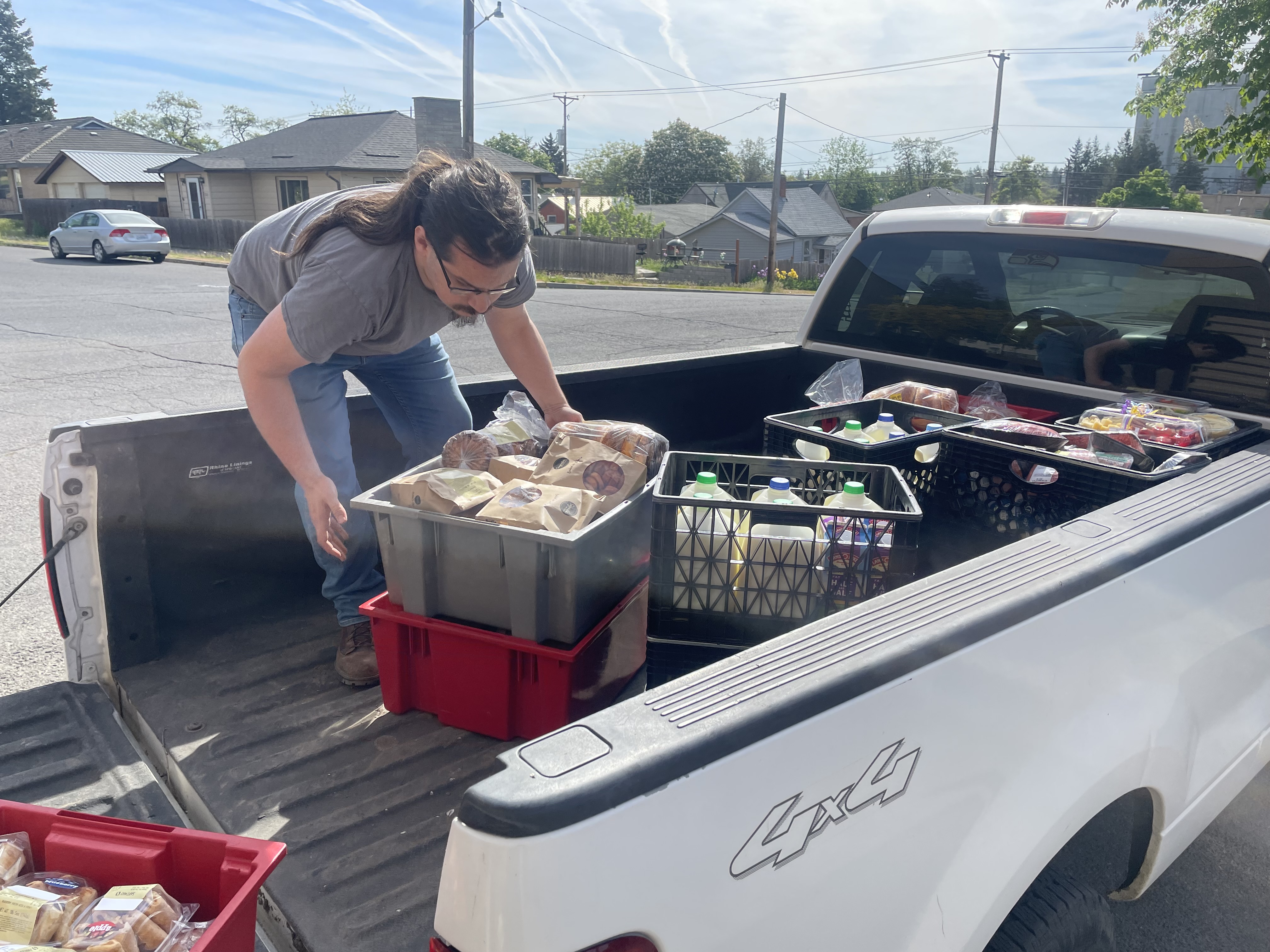 Volunteers putting away pantry donations